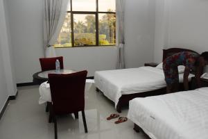 Postel nebo postele na pokoji v ubytování Kenlon Hotel Kampala
