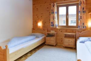 Posteľ alebo postele v izbe v ubytovaní Pension Haus Romy