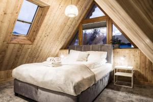 Postel nebo postele na pokoji v ubytování Willa Kozincówka