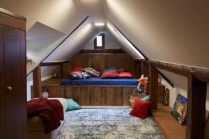 Tempat tidur dalam kamar di Babaház
