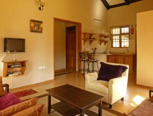 Zona de estar de Milimani Cottages