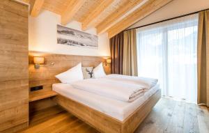 Giường trong phòng chung tại Landhaus Moosbrugger