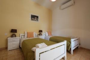 מיטה או מיטות בחדר ב-Eftyxia apartments