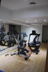 a gym with several exercise bikes in a room at Arenales Apartamento in Buenos Aires