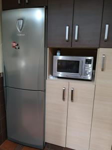 Η κουζίνα ή μικρή κουζίνα στο Apartamento Árbol de vida - cerca Estadio Cartuja +38 φωτογραφίες