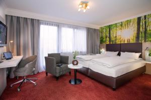 TV a/nebo společenská místnost v ubytování Hotel Adler