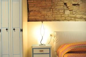 A bed or beds in a room at Vico Del Poeta