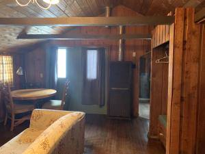 a bathroom with a sink, toilet and a window at Rundle Chalets in Canmore