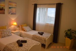Кровать или кровати в номере Luxury Apartment