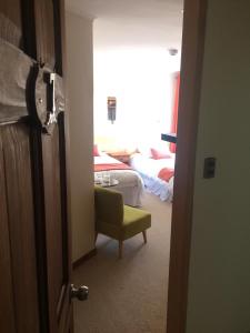 Кровать или кровати в номере Puerto Austral