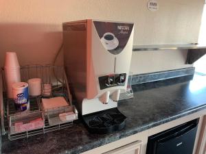 a mixer sitting on top of a kitchen counter at Americas Best Value Inn Hobby Airport in Houston