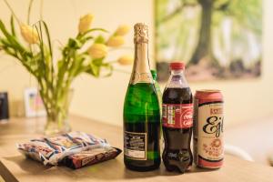 two bottles of beer sitting on a table at FLEXIHOME SK - Trieda SNP - private parking spot in Košice