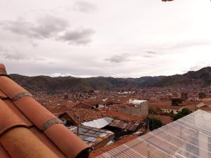 a view of a city from the roof of a building at Posada San Blas in Cusco
