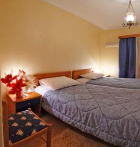 Tempat tidur dalam kamar di Hotel Marily