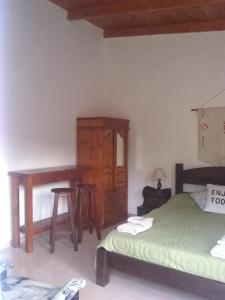 Postel nebo postele na pokoji v ubytování La Vilma Hospedaje Familiar + 32 fotografií