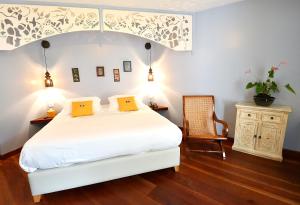 Postel nebo postele na pokoji v ubytování Tsilaosa Hôtel