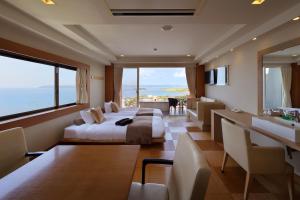 a hotel room with a bed and a sink at The Shinra in Tateyama