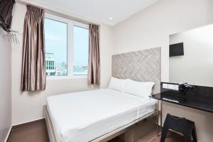 เตียงในห้องที่ ibis budget Singapore Ruby