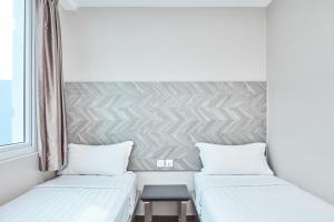 เตียงในห้องที่ ibis budget Singapore Ruby