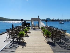 a row of chairs and an aisle with a wedding ceremony at Q Station in Sydney