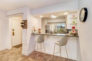 a kitchen with two stools at a counter in a room at Saddlebrook Amazing View & Spacious 2 bed/2bath in Wesley Chapel