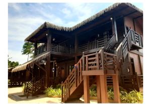 a house with a staircase leading up to it at Nilaveli Beach Resort - Level 1 Certified in Nilaveli