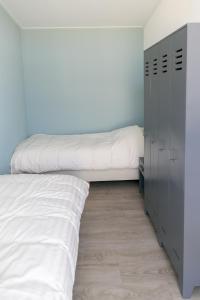 Postel nebo postele na pokoji v ubytování 6p Luxe bungalow met serre