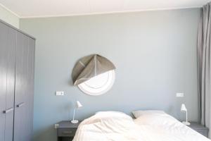 Llit o llits en una habitació de 6p Luxe bungalow met serre