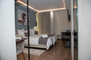 Voodi või voodid majutusasutuse NJ Hotel Rabat toas