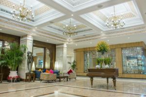 a lobby with a piano in a building at Clarks Amer in Jaipur