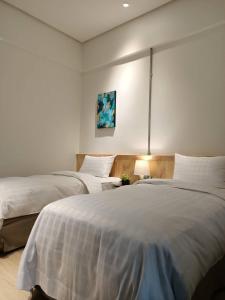 Postel nebo postele na pokoji v ubytování Home Rest Hotel 2