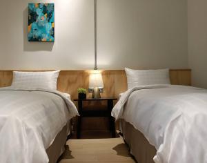Postel nebo postele na pokoji v ubytování Home Rest Hotel 2