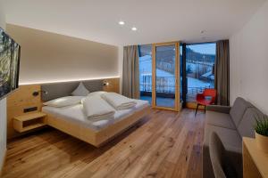 Postel nebo postele na pokoji v ubytování Hotel Mair