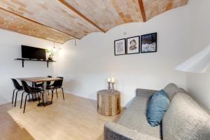 a living room with a couch and a table at Adventure Park Apartments in Ringkøbing