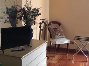 TV a/nebo společenská místnost v ubytování Casa di Lucia B&B
