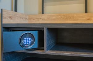 a microwave oven sitting inside of a wooden cabinet at Boutique 053 Hamburg Main Station in Hamburg