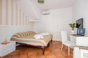 Łóżko lub łóżka w pokoju w obiekcie Residenza Reale