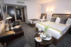 Katil atau katil-katil dalam bilik di McGettigans Hotel
