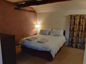 Säng eller sängar i ett rum på Bay Tree Cottage Accommodation