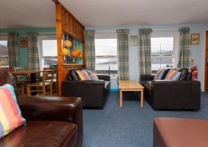 
a living room filled with furniture and a couch at Ullapool Youth Hostel in Ullapool
