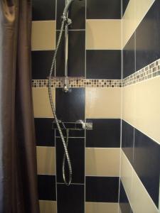 a bathroom with a shower with blue and white tiles at Nizza - Boutique Wohnung - near Hotel Negresco in Nice