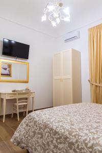 Postel nebo postele na pokoji v ubytování Palazzo Le Travi