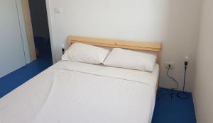 Posteľ alebo postele v izbe v ubytovaní villa Lùmar fronte mare