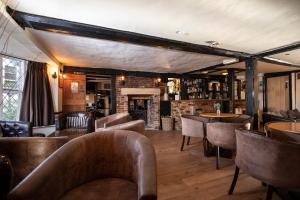 The lounge or bar area at The Cock Inn Hotel