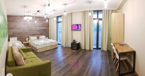 TV a/nebo společenská místnost v ubytování Wine Hotel Chisinau