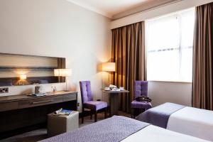 Voodi või voodid majutusasutuse Brandon House Hotel toas