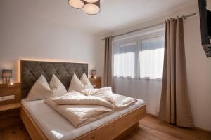 Posteľ alebo postele v izbe v ubytovaní Apart Platzer