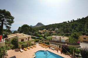 a view of a house with a swimming pool at PINOS ALTOS 06 in Cala de Sant Vicenc