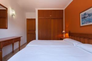 A bed or beds in a room at PINOS ALTOS 10