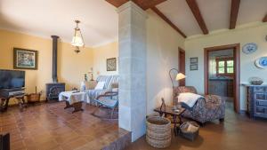 a living room with a couch and a fireplace at Casa Bonaire Esporles in Esporles